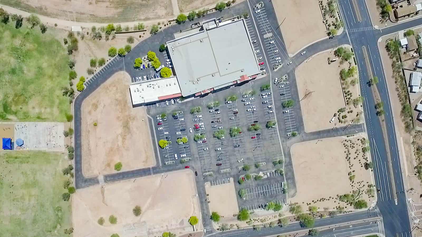 drone photo looking down at shopping center and parking lot