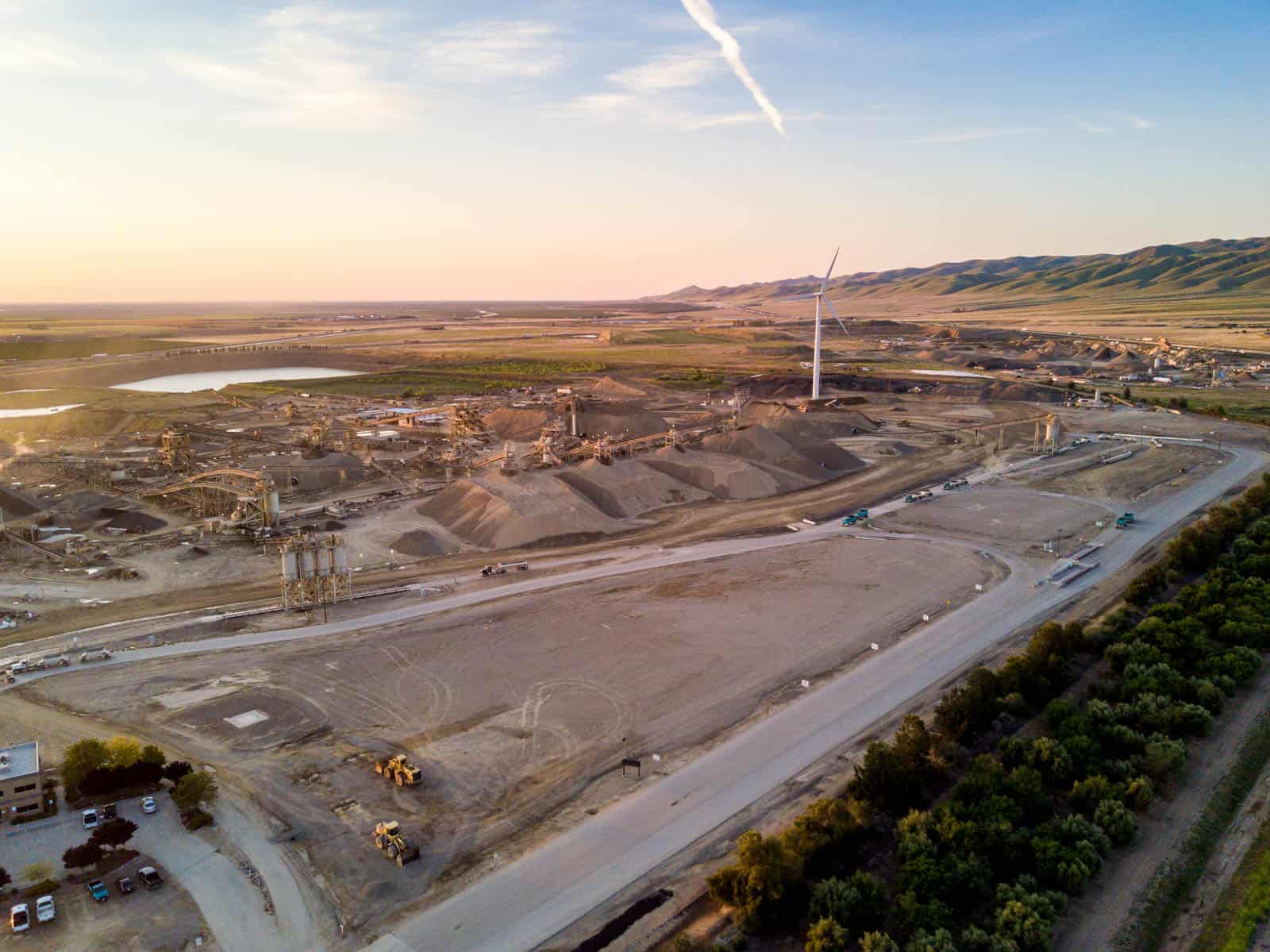 wind turbine on construction site with mounds of dirt in California