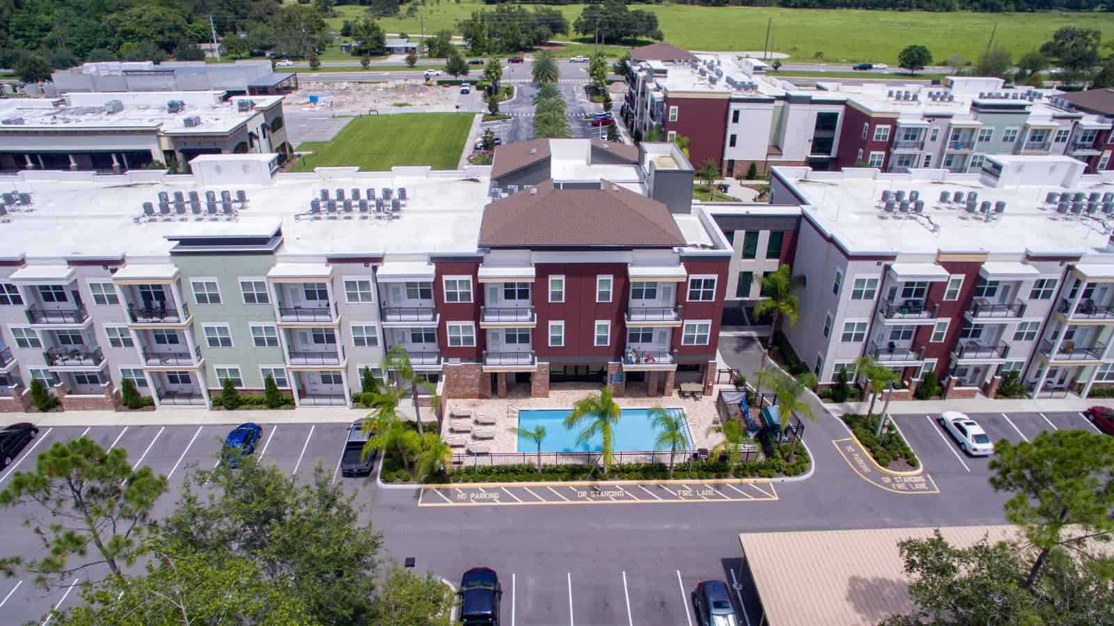 back view of an apartment complex with swimming pool in Florida