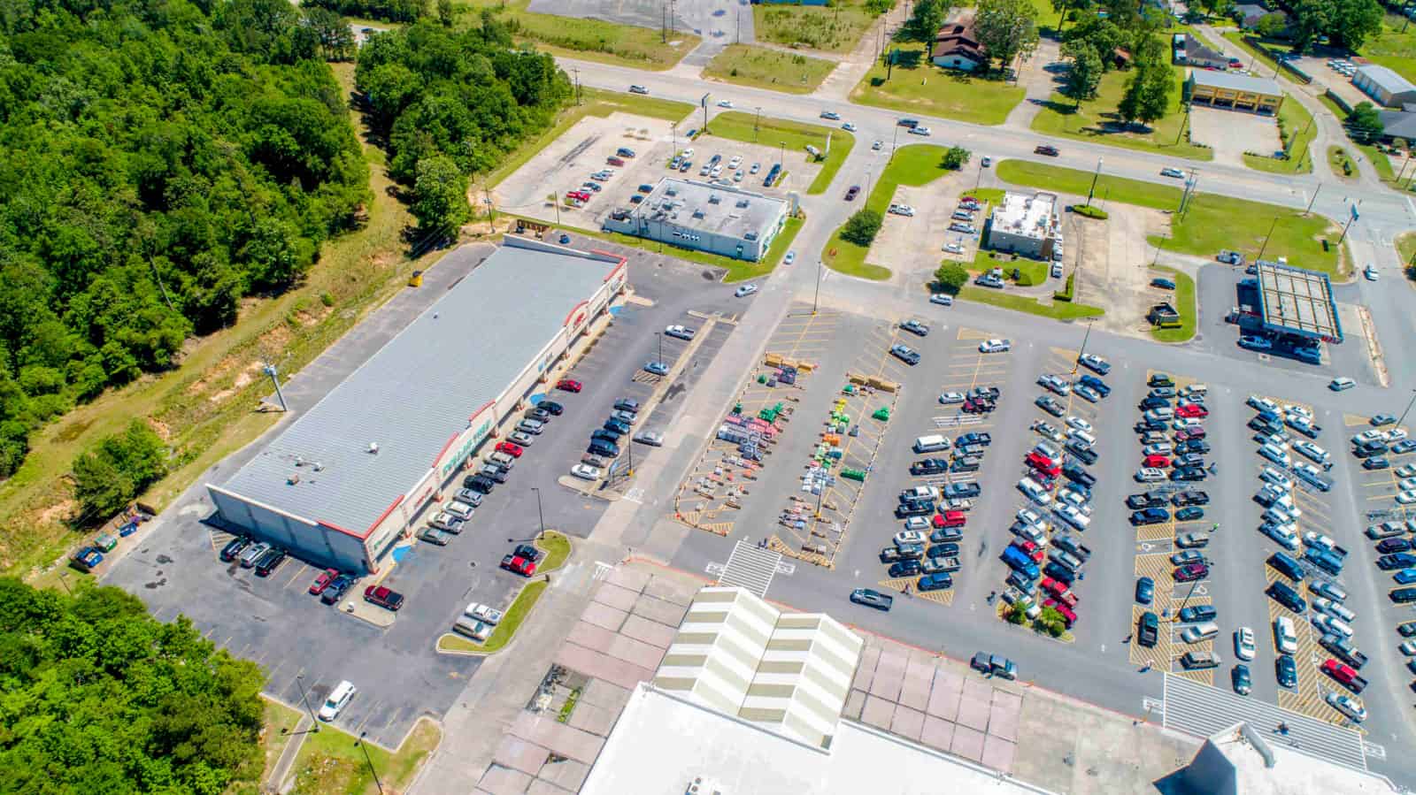 shopping plaza with full parking lot drone photo in Louisiana