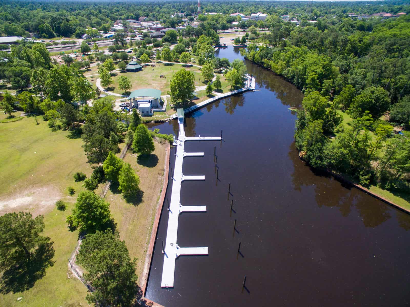 aerial drone photo of dock on lake next to park in Lousiana