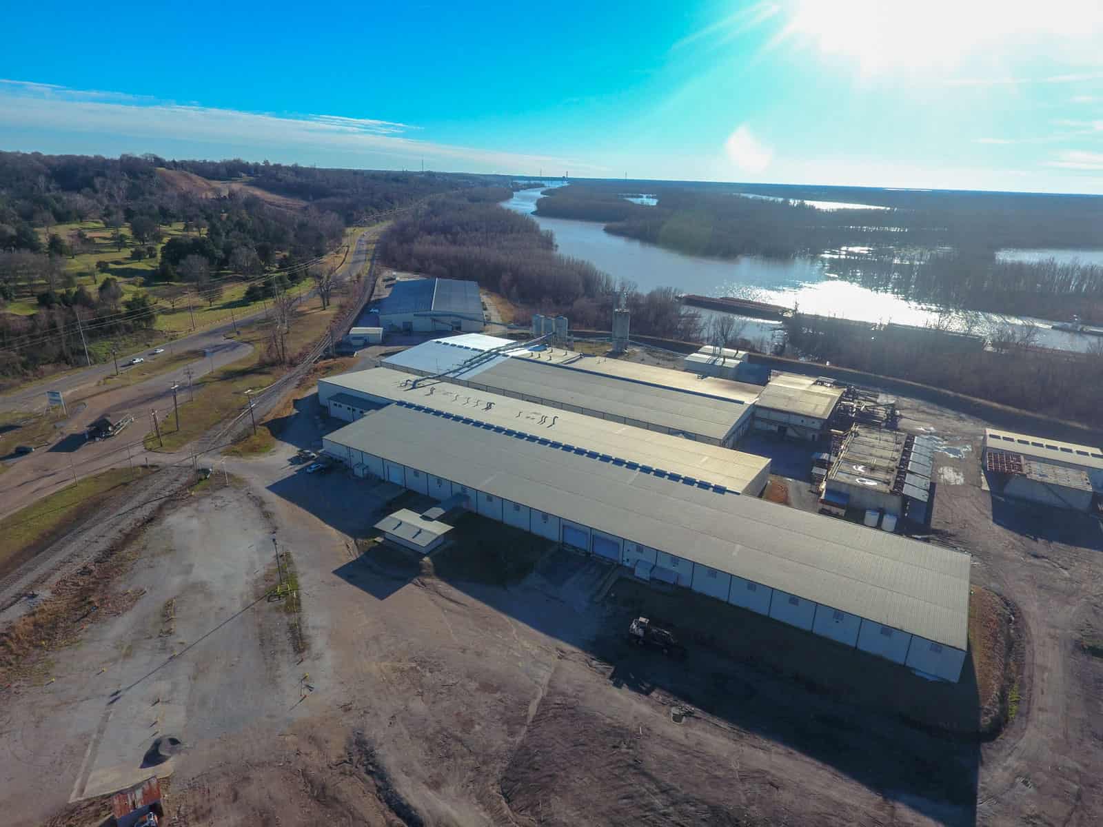 large building and facility next to river in Mississippi