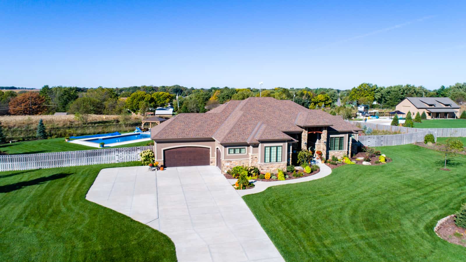 residential property with home and swimming pool shot from drone in Nebraska