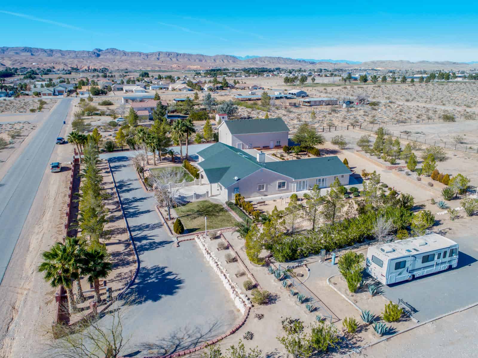 drone photo of house in Nevada with RV parked in driveway
