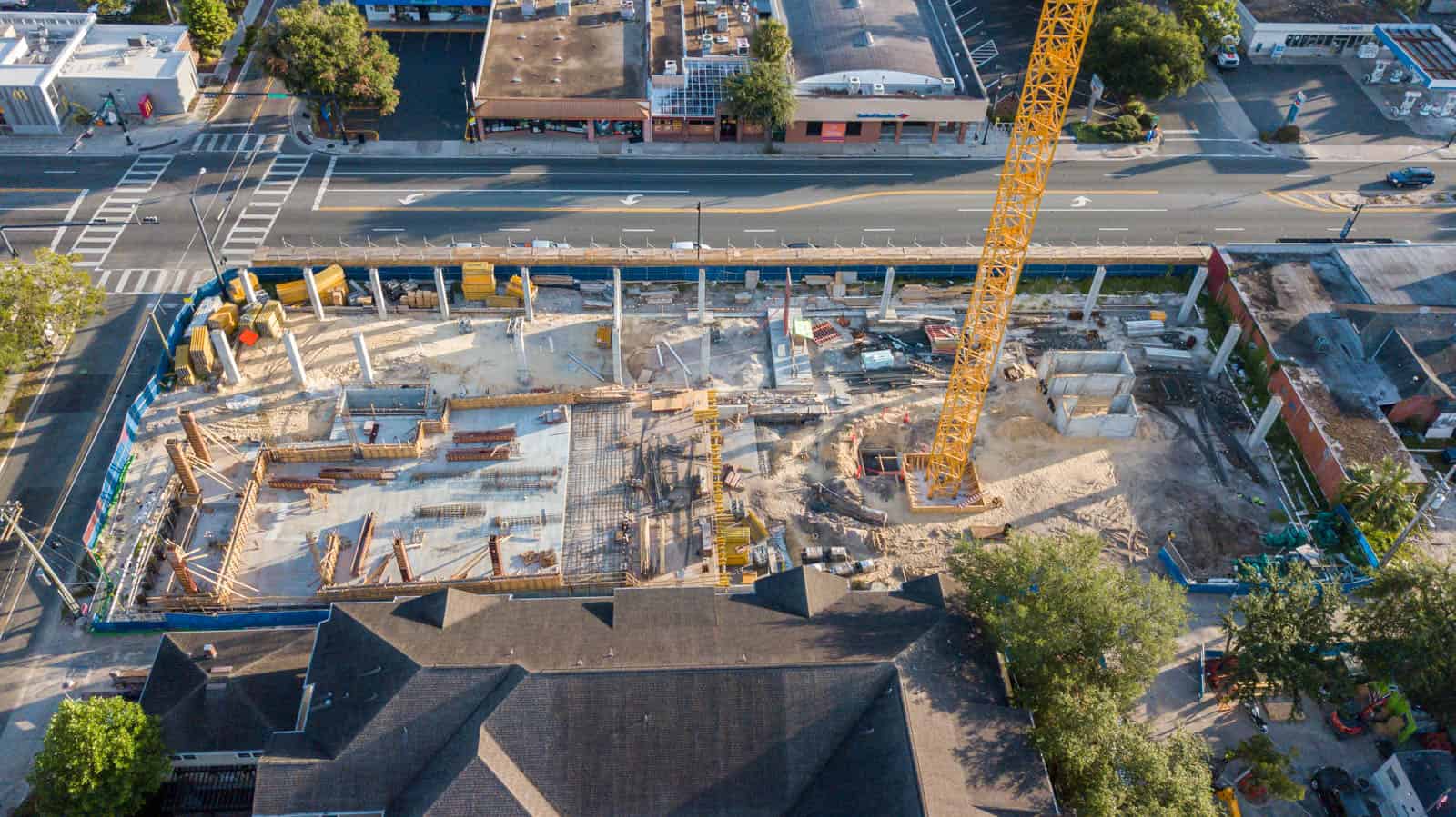 aerial drone photo of construction site in Gainesville, FL with crane in shot