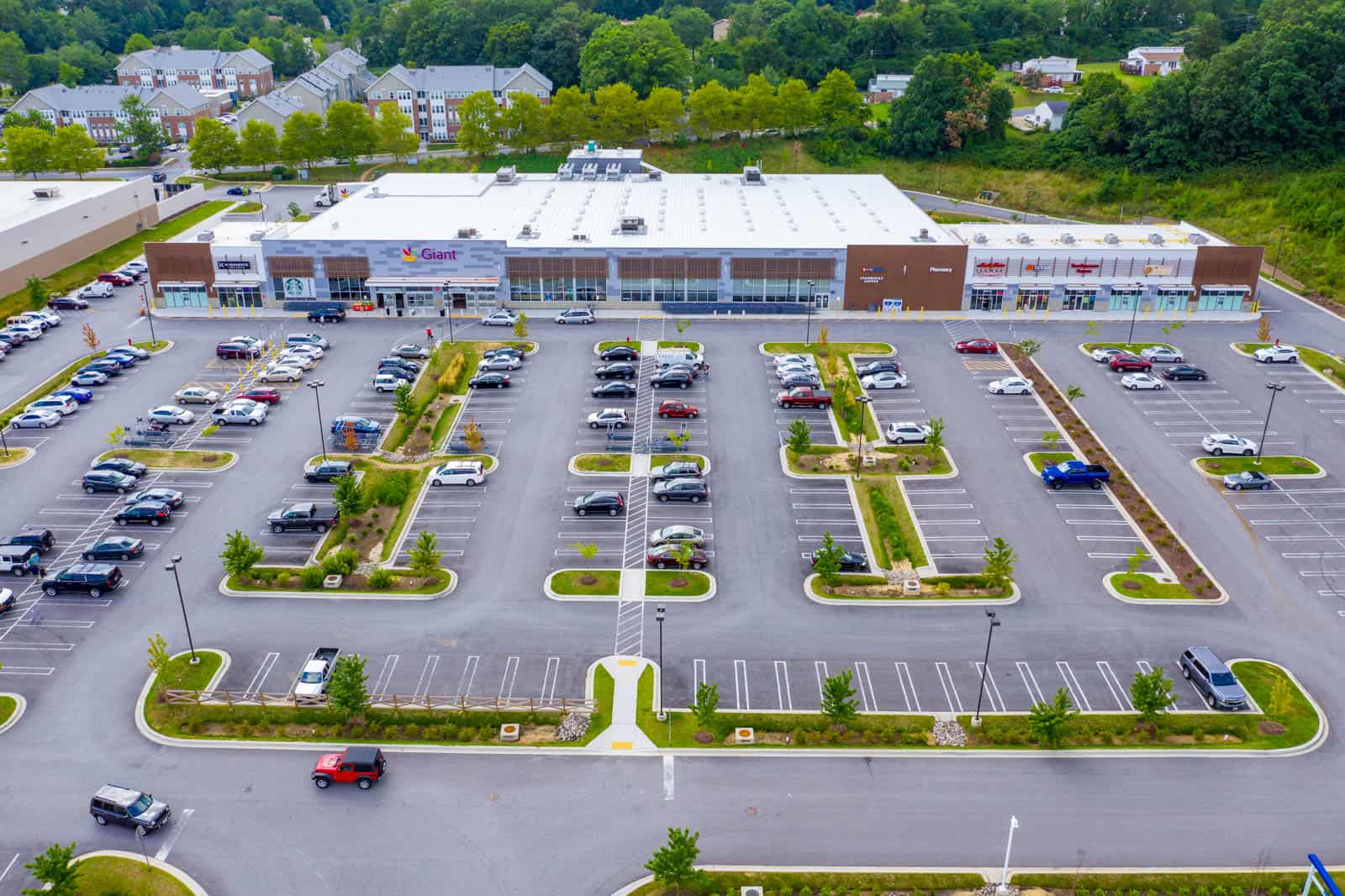 arial drone photo of shopping plaza in Baltimore, Maryland facing the storefronts