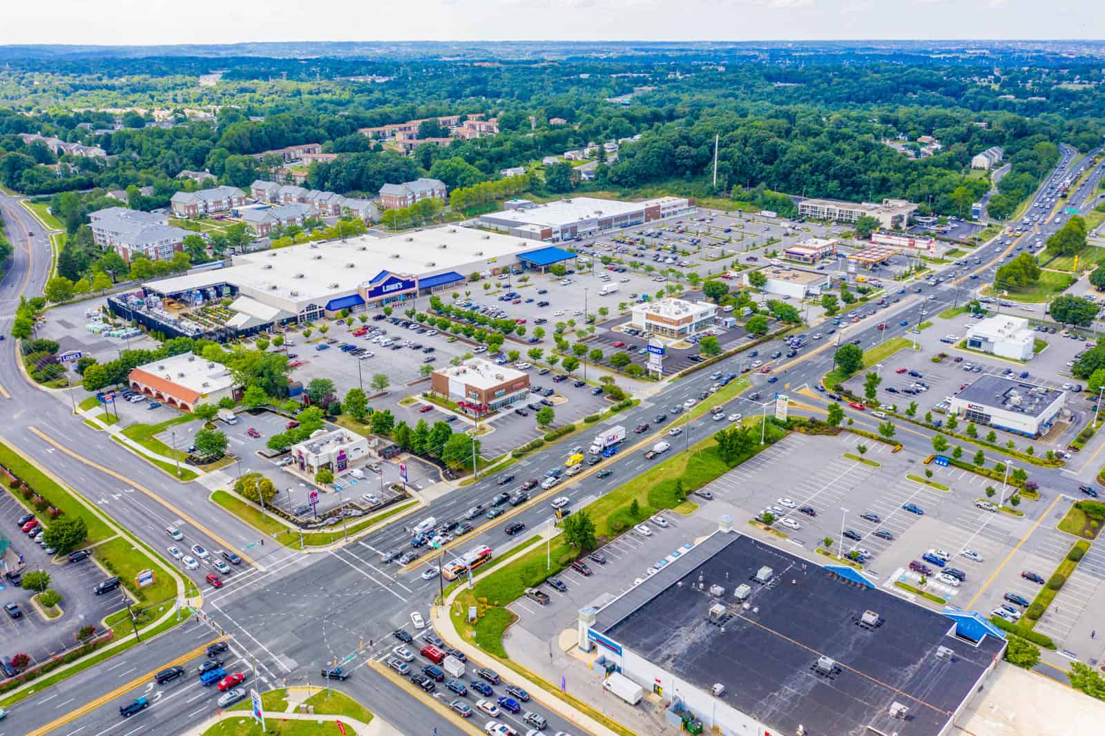 aerial drone photo of commercial real estate property in Gainesville, GA with full building and parking lot in view